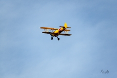D8504150-Bi-plane-flying-overhead